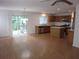 Open-concept living space with wood floors seamlessly connecting the living and kitchen areas at 215 Silver Spring St, Dallas, GA 30157