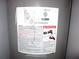 Close-up of the water heater, showing safety warnings, labels, and certifications at 215 Silver Spring St, Dallas, GA 30157