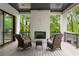 Relaxing outdoor deck with brick fireplace, ideal for enjoying nature views and outdoor living at 4091 Oak Forest Drive Ne, Brookhaven, GA 30319