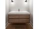 Modern bathroom with a floating vanity with drawers and contemporary light fixtures at 4091 Oak Forest Drive Ne, Brookhaven, GA 30319