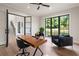 Bright office with natural light, modern desk, comfortable seating, and hardwood floors at 4091 Oak Forest Drive Ne, Brookhaven, GA 30319