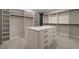 A spacious walk-in closet with custom shelving and center island at 4091 Oak Forest Drive Ne, Brookhaven, GA 30319