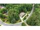 Aerial view of home nestled among mature trees and lush landscaping in a desirable neighborhood at 4995 Aviary Nw Dr, Acworth, GA 30101