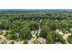 Expansive aerial view of home surrounded by lush green trees at 4995 Aviary Nw Dr, Acworth, GA 30101