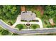 Aerial view of home showcasing circular driveway and meticulously landscaped property at 4995 Aviary Nw Dr, Acworth, GA 30101