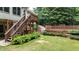 Beautiful landscape with stairs to fenced in backyard and lush green foliage at 4995 Aviary Nw Dr, Acworth, GA 30101
