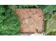 Aerial view of backyard featuring a fenced mulched area and horseshoe pit at 4995 Aviary Nw Dr, Acworth, GA 30101