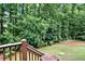 Backyard view from deck overlooking yard with trees and lawn at 4995 Aviary Nw Dr, Acworth, GA 30101