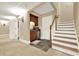 Spacious basement featuring stairs, wet bar with dark wood cabinets and stainless steel mini-refrigerator at 4995 Aviary Nw Dr, Acworth, GA 30101