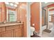 Bathroom vanity with granite countertops, sink, and a view of the shower at 4995 Aviary Nw Dr, Acworth, GA 30101