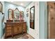 Bathroom with a decorative vanity, tri-fold mirror and glass-enclosed shower at 4995 Aviary Nw Dr, Acworth, GA 30101