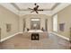 Open bathroom featuring a large soaking tub, tray ceilings, and tile flooring at 4995 Aviary Nw Dr, Acworth, GA 30101
