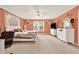 Spacious primary bedroom with carpet, ceiling fan, and windows for natural light at 4995 Aviary Nw Dr, Acworth, GA 30101