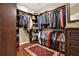 Walk-in closet featuring custom shelves and hanging racks for maximum storage at 4995 Aviary Nw Dr, Acworth, GA 30101