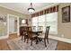 Formal dining room with natural light, wood floors, and seating for six at 4995 Aviary Nw Dr, Acworth, GA 30101