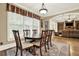 Bright dining room featuring a large window, wood table, and decorative rug at 4995 Aviary Nw Dr, Acworth, GA 30101