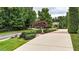 Long driveway with manicured landscaping and mature trees at 4995 Aviary Nw Dr, Acworth, GA 30101