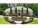Stately brick home with manicured landscaping, circular driveway, and mature trees at 4995 Aviary Nw Dr, Acworth, GA 30101