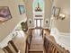 Grand foyer featuring hardwood floors, a high ceiling, chandelier, and staircase with decorative iron railings at 4995 Aviary Nw Dr, Acworth, GA 30101