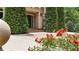 A brick entranceway featuring lush, mature evergreens and flowering bushes at 4995 Aviary Nw Dr, Acworth, GA 30101