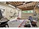Spacious garage with natural light, equipped with tools and machinery for various projects at 4995 Aviary Nw Dr, Acworth, GA 30101