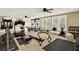 Well-equipped home gym with multiple workout machines, free weights, and ample space for fitness activities at 4995 Aviary Nw Dr, Acworth, GA 30101