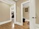 Hallway featuring hardwood floors and easy access to the bathroom and bedroom at 4995 Aviary Nw Dr, Acworth, GA 30101