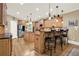Large kitchen island with stainless steel appliances, bar seating, and custom cabinets at 4995 Aviary Nw Dr, Acworth, GA 30101