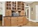 Spacious kitchen features custom cabinets, granite counters, and tile backsplash at 4995 Aviary Nw Dr, Acworth, GA 30101