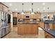 Gourmet kitchen showcasing granite countertops, stainless appliances, and oak cabinets at 4995 Aviary Nw Dr, Acworth, GA 30101