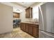 Functional laundry room with stainless fridge, sink, storage, and modern washer/dryer at 4995 Aviary Nw Dr, Acworth, GA 30101