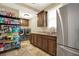 Functional laundry room with stainless fridge, sink, storage, and modern washer/dryer at 4995 Aviary Nw Dr, Acworth, GA 30101