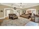 Large living room features an open floor plan, coffered ceiling, and neutral color palette at 4995 Aviary Nw Dr, Acworth, GA 30101