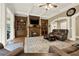 Inviting living area with fireplace, custom built-ins, and neutral color palette at 4995 Aviary Nw Dr, Acworth, GA 30101
