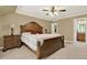 Inviting bedroom with a wooden bed frame, night stands and access to a bathroom at 4995 Aviary Nw Dr, Acworth, GA 30101