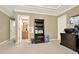Home office with trey ceiling, carpet, large windows, and ample workspace at 4995 Aviary Nw Dr, Acworth, GA 30101