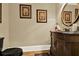 Elegant powder room features a vanity, decorative mirror, and beautiful wall decor at 4995 Aviary Nw Dr, Acworth, GA 30101