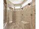 Bathroom shower area with custom tile, bench, and showerhead at 4995 Aviary Nw Dr, Acworth, GA 30101