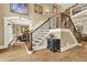 Grand foyer with staircase featuring iron railings and hardwood floors at 4995 Aviary Nw Dr, Acworth, GA 30101