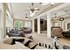 Open concept living area features large windows for natural light and multiple seating arrangements at 4995 Aviary Nw Dr, Acworth, GA 30101