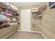 Walk-in closet with shelving and a door at 4995 Aviary Nw Dr, Acworth, GA 30101