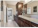Bathroom vanity boasts granite counters, wood cabinetry and decor leading to the bedroom at 5365 Vendelay Ln, Cumming, GA 30040
