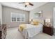 Bright bedroom with large windows, a full-sized bed, and soft, inviting decor at 5365 Vendelay Ln, Cumming, GA 30040