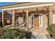 Inviting front porch with comfortable seating, a welcoming entrance, and charming architectural details, perfect for relaxation at 5365 Vendelay Ln, Cumming, GA 30040