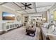 Open-concept living room featuring coffered ceilings, hardwood floors, and a modern color palette at 5365 Vendelay Ln, Cumming, GA 30040