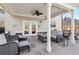 Inviting covered patio featuring comfortable seating, ceiling fan, and stylish decor at 5365 Vendelay Ln, Cumming, GA 30040