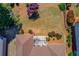 Aerial view of backyard with grass area, landscaping, patio and roof at 836 Windsor Place Ct, Grayson, GA 30017