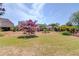 Expansive backyard featuring lush green grass and mature landscaping at 836 Windsor Place Ct, Grayson, GA 30017