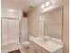 Bathroom featuring a walk-in shower, white cabinets, and tile flooring at 836 Windsor Place Ct, Grayson, GA 30017