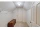 View of the walk-in closet with shelving, storage chest and white door at 836 Windsor Place Ct, Grayson, GA 30017